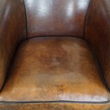 Sheep leather club chair finished with black piping