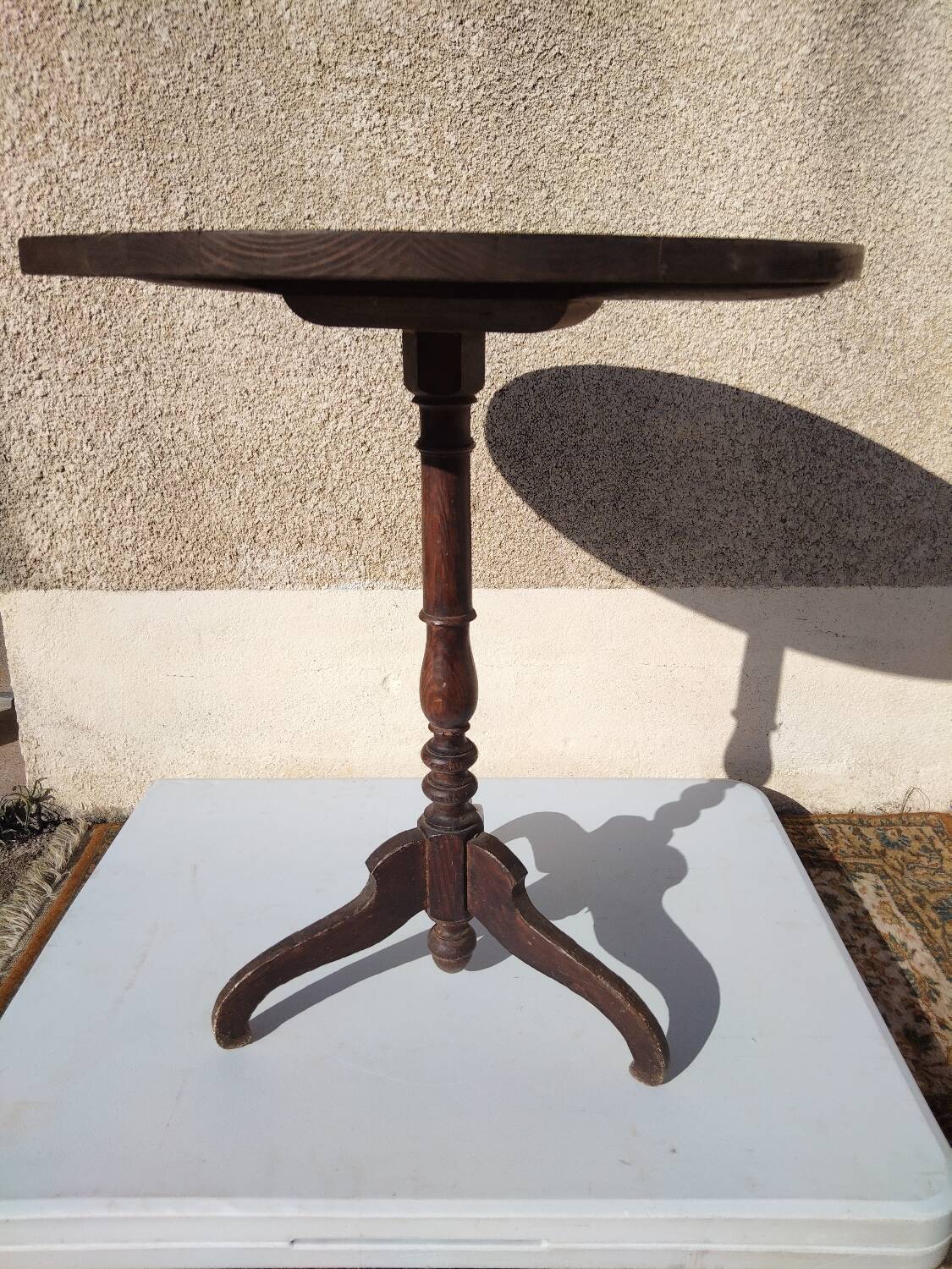 Small rustic antique tripod side table made of solid wood.