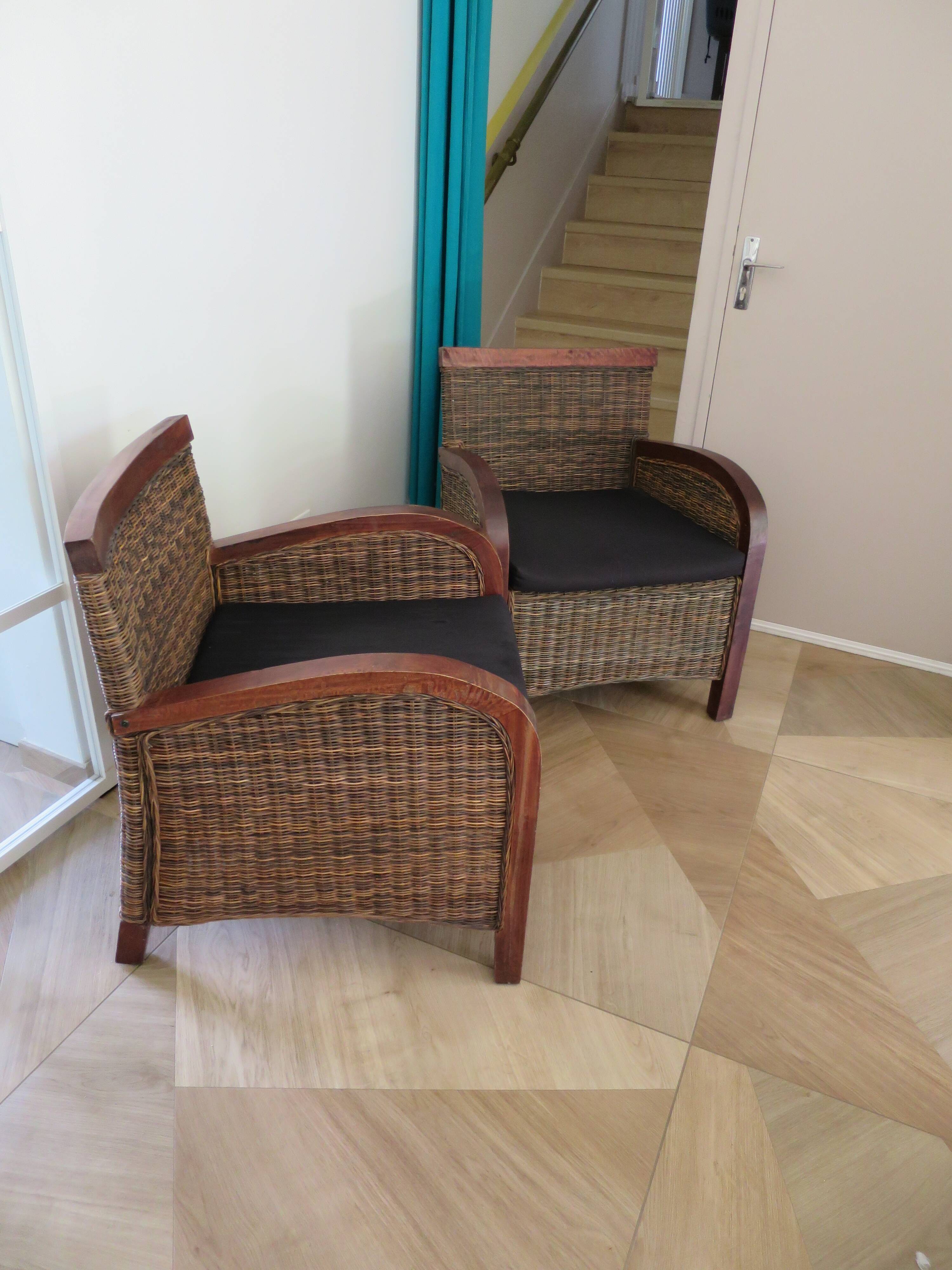2 colonial-style armchairs in woven rattan and exotic wood