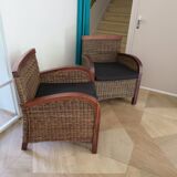 2 colonial-style armchairs in woven rattan and exotic wood
