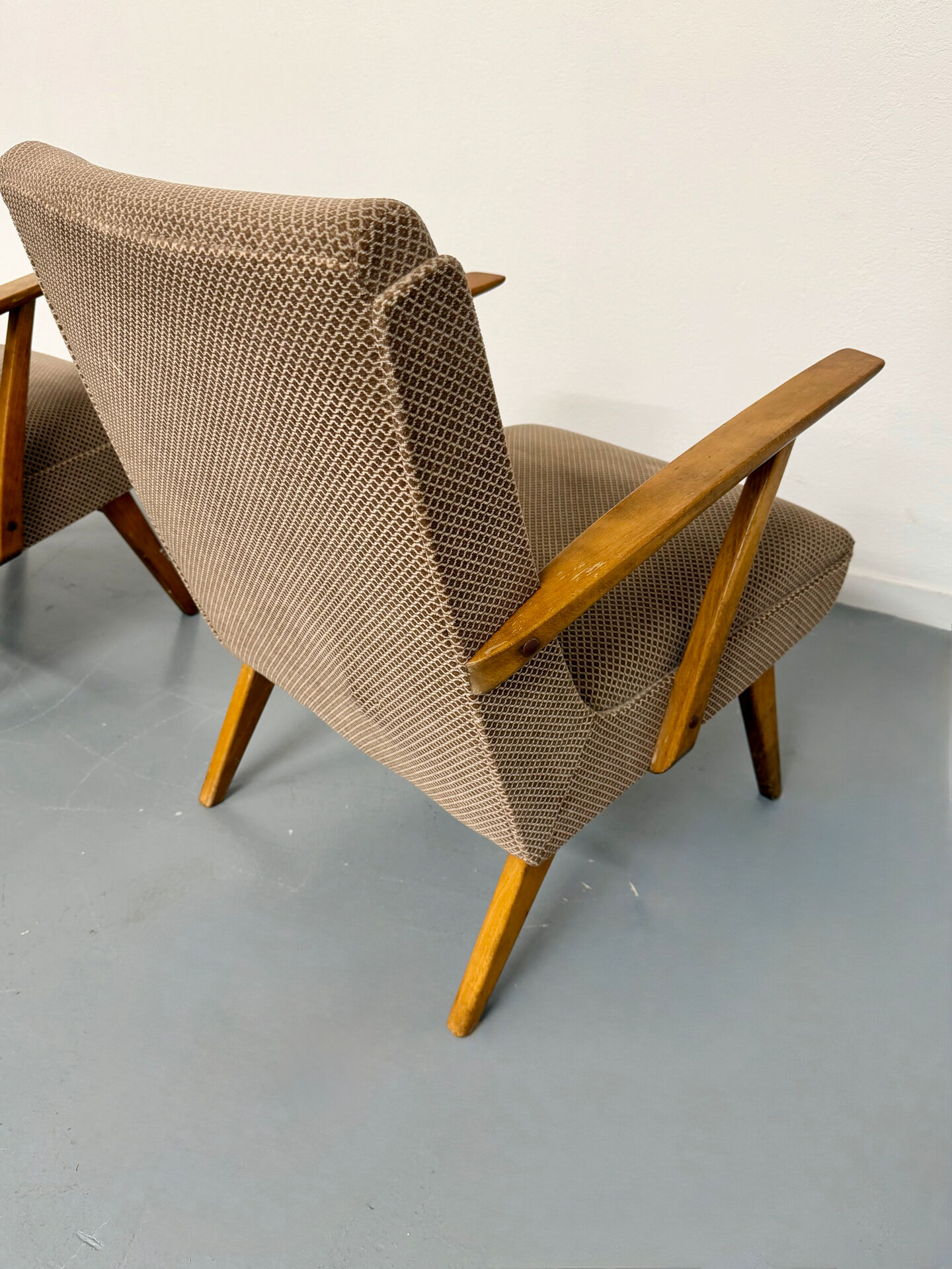 Set of 2 vintage wooden and fabric armchairs designed in the 1960s.
