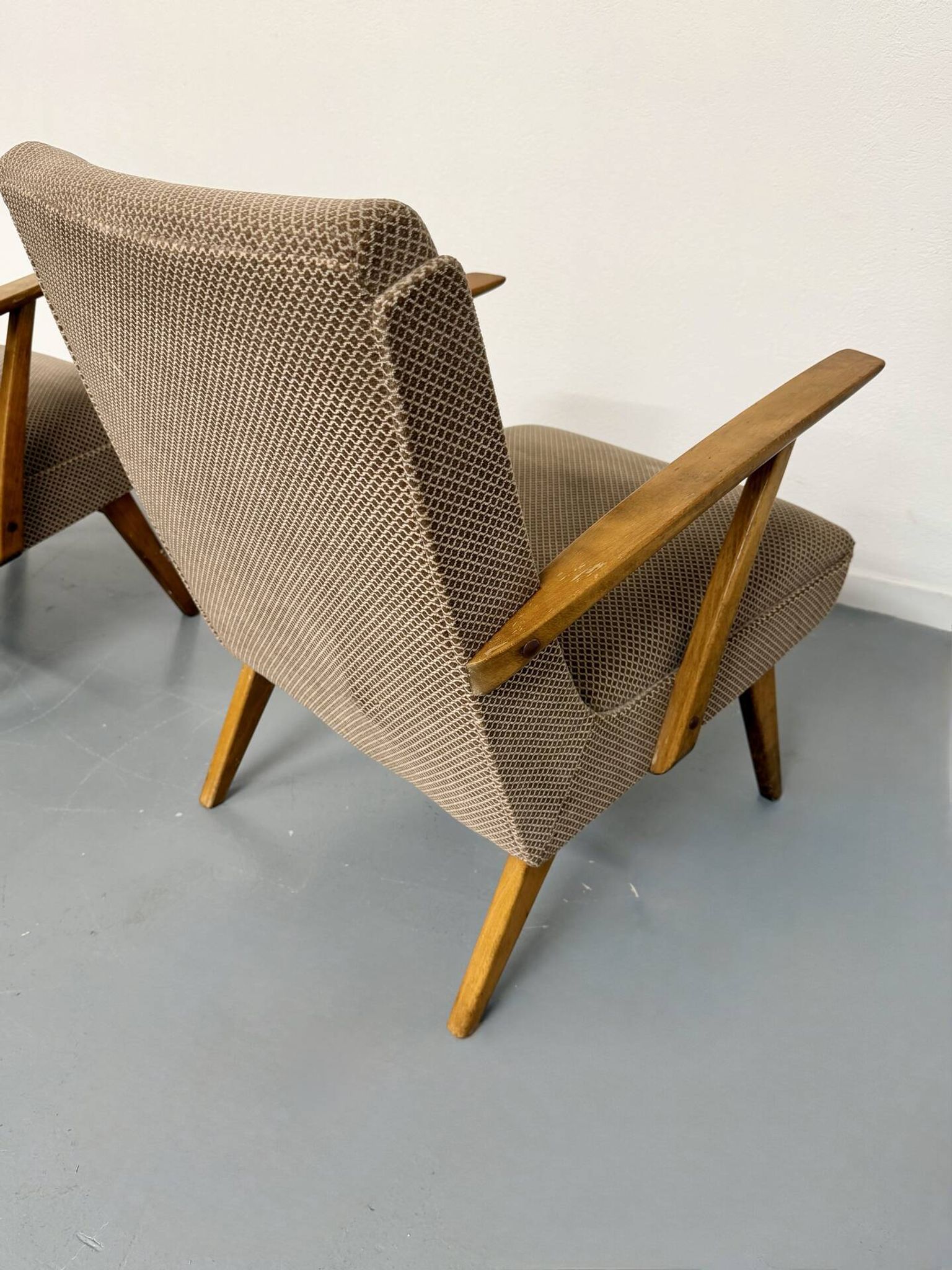 Set of 2 vintage wooden and fabric armchairs designed in the 1960s.