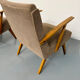 Set of 2 vintage wooden and fabric armchairs designed in the 1960s.