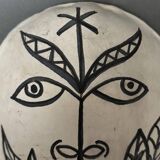 Africanist mask in glazed white terracotta, face signed Colette.