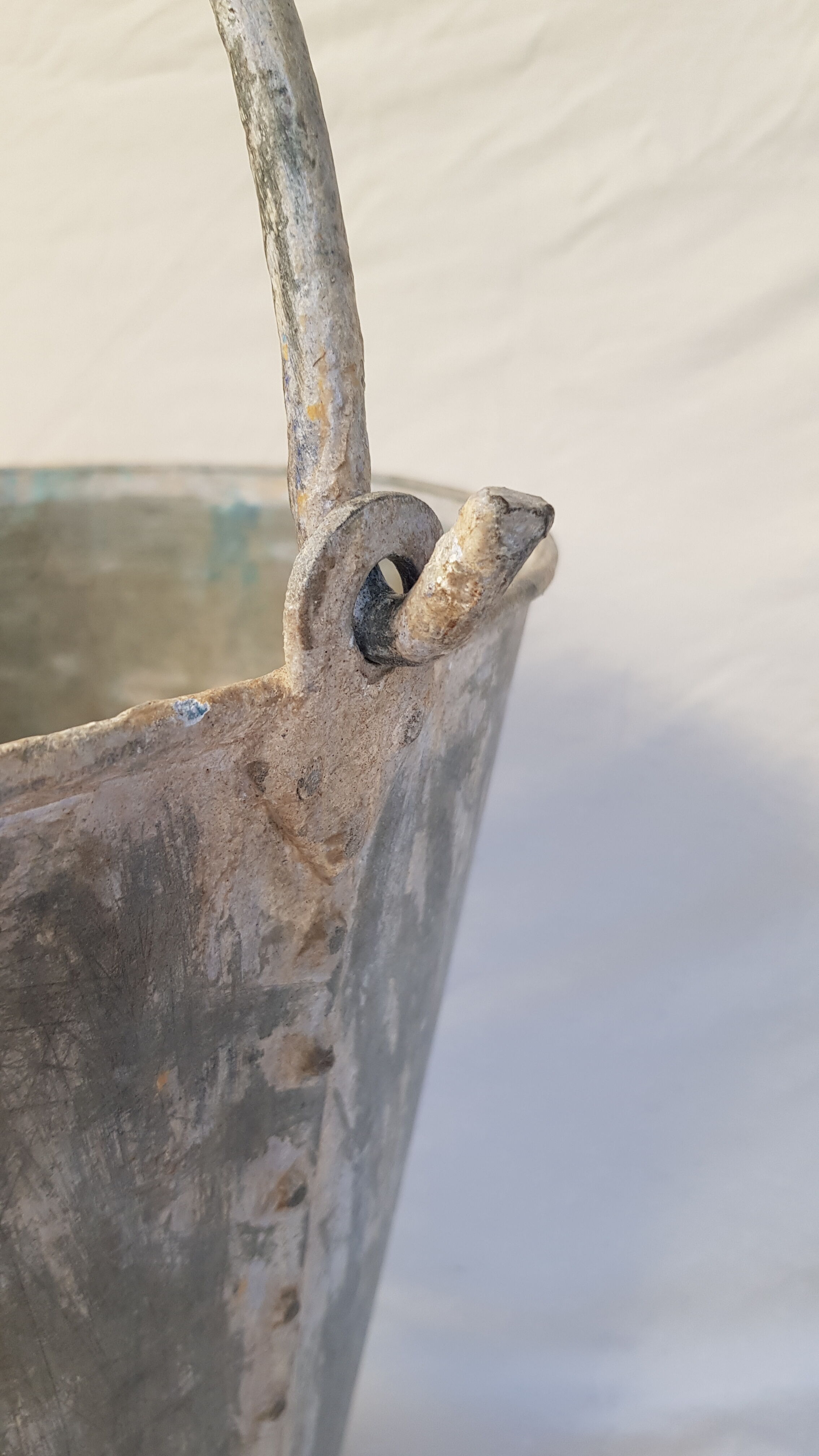 Old bucket with thick zinc handle