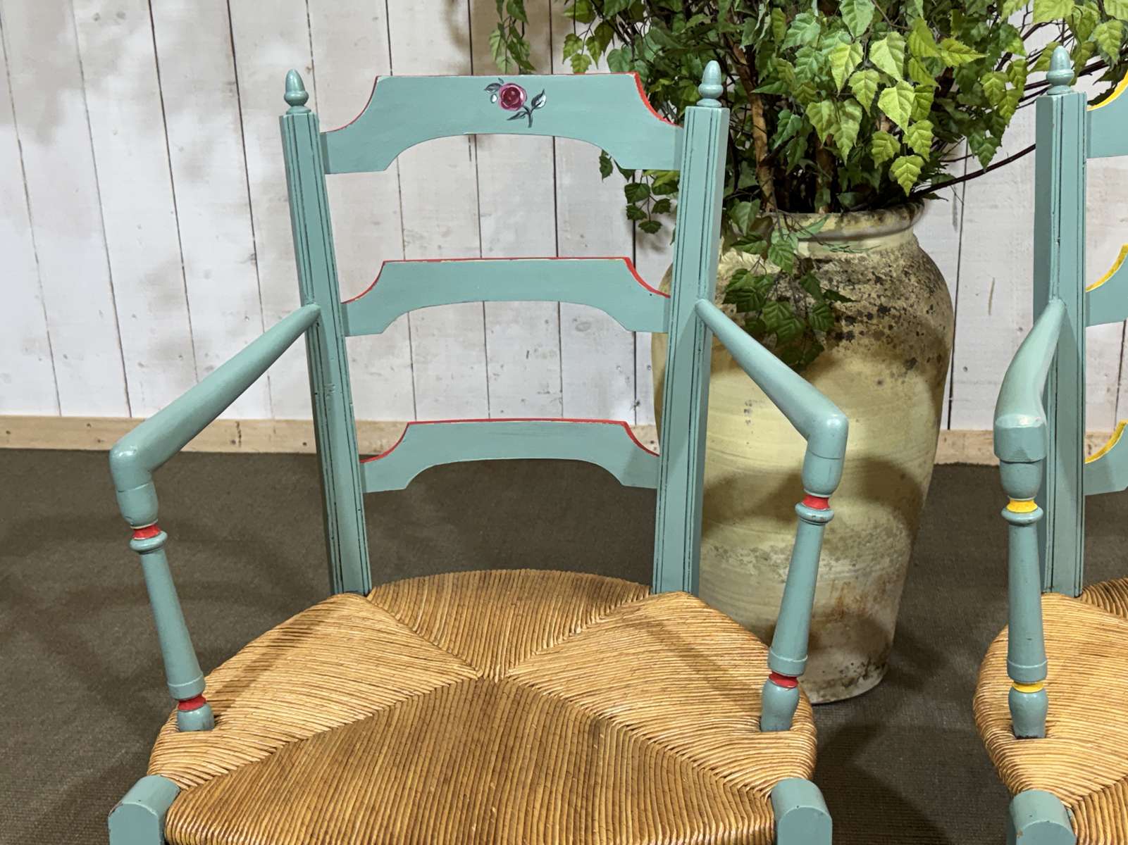 Pair of rustic armchairs in beech with straw seats.