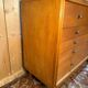 Vintage 1950s oak commode with tapered legs.