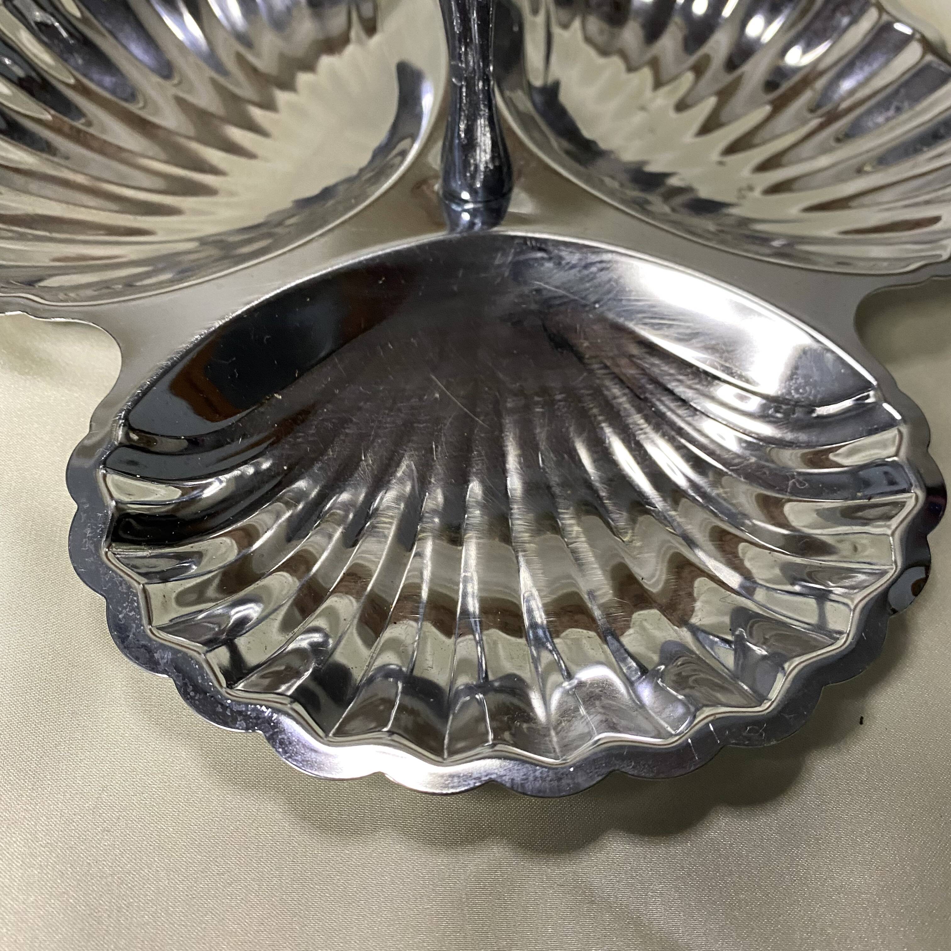 Stainless steel serving platter in the shape of seashells