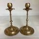 Pair of brass candlesticks with worked flower balls.