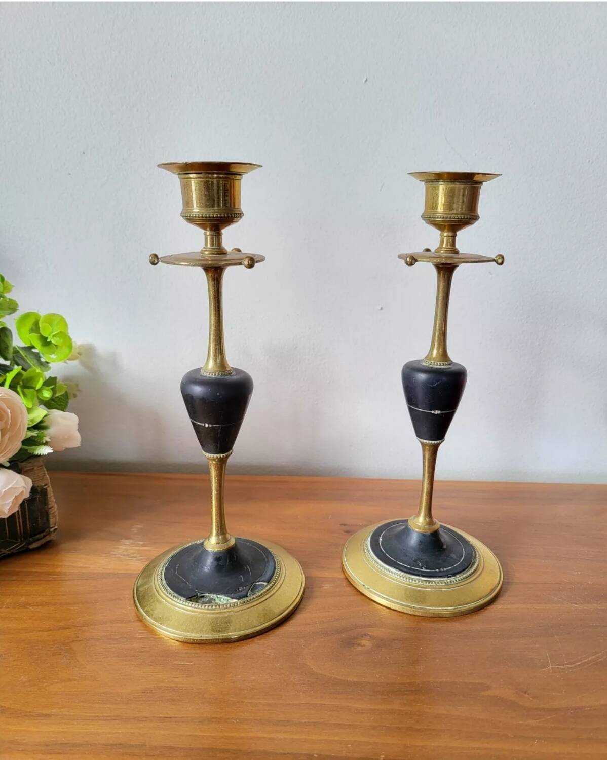Pair of brass and black hard stone candlesticks