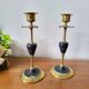 Pair of brass and black hard stone candlesticks