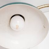 Green and gold articulated desk lamp