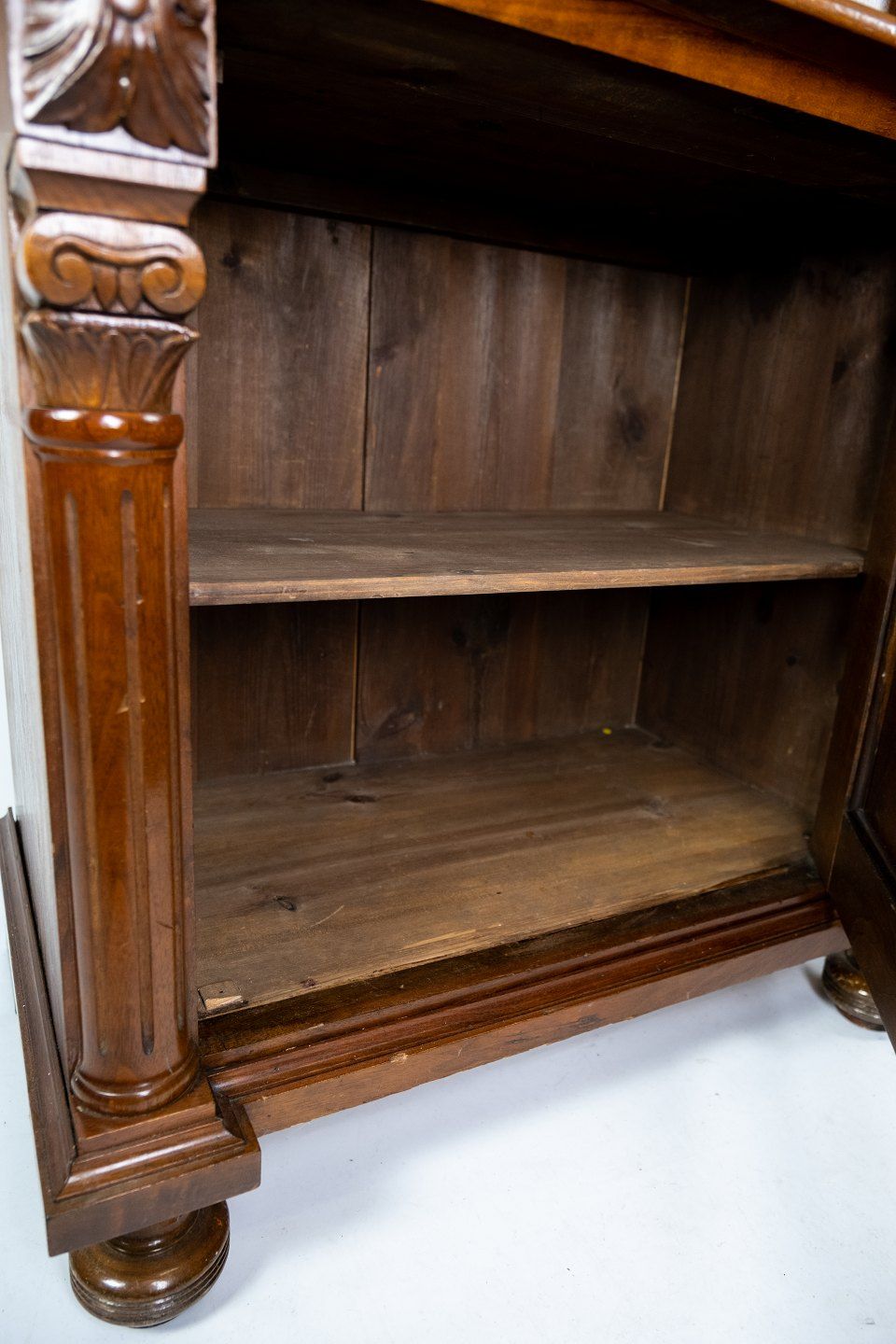 Glass cabinet of light walnu from the 1880s