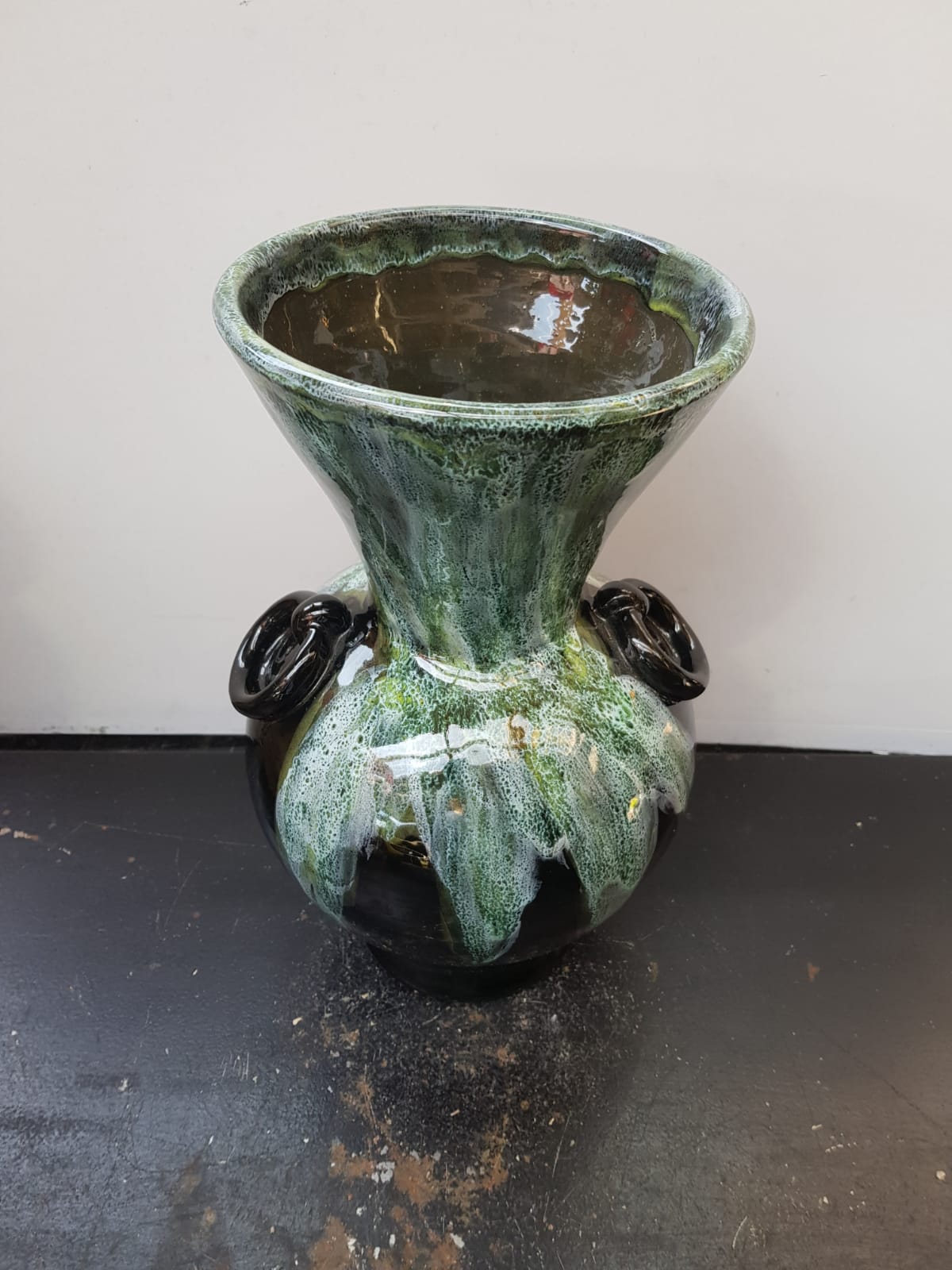 Old black enamelled ceramic Gaubier vase with green white vintage drips