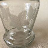 Small carafe in blown cut glass with engraved decoration of vine leaves and grapes, threaded stopper
