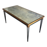 Patinated and gilded steel coffee table in the style of Jacques Quinet.