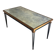 Table basse en acier patiné et doré dans le goût de Jacques Quinet