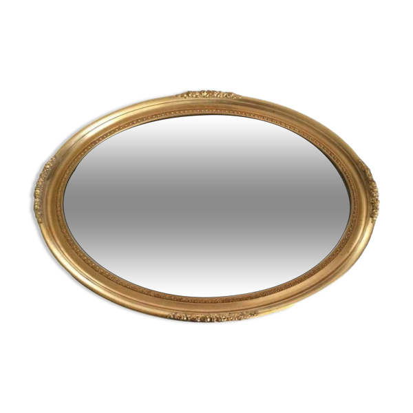 Miroir ovale biseauté cadre bois doré sculpté