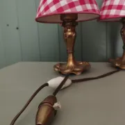 Pair of small lamps in gilded bronze by Petitot and red gingham lampshades.