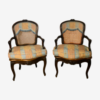Convertible armchairs Louis XV era in walnut moulded and cannes