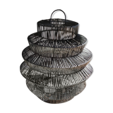 Braided rattan suspension in the shape of a black accordion