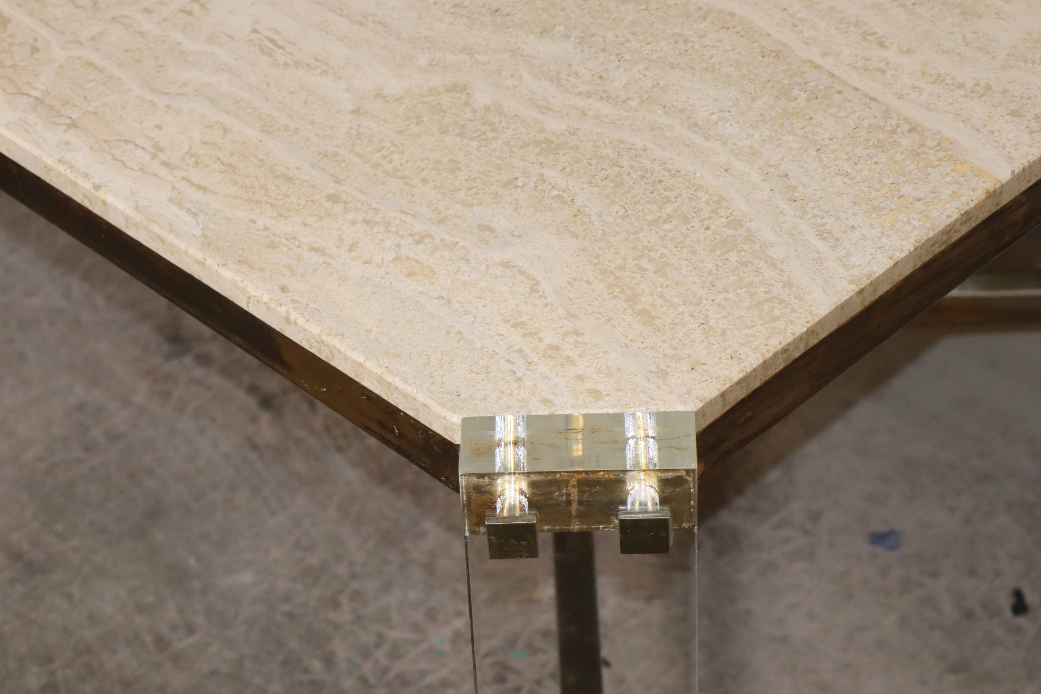 1970s dining table in travertine, gold metal and plexiglass.