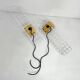 Pair of yellow wall sconces on wire mesh by Seccose, 1980