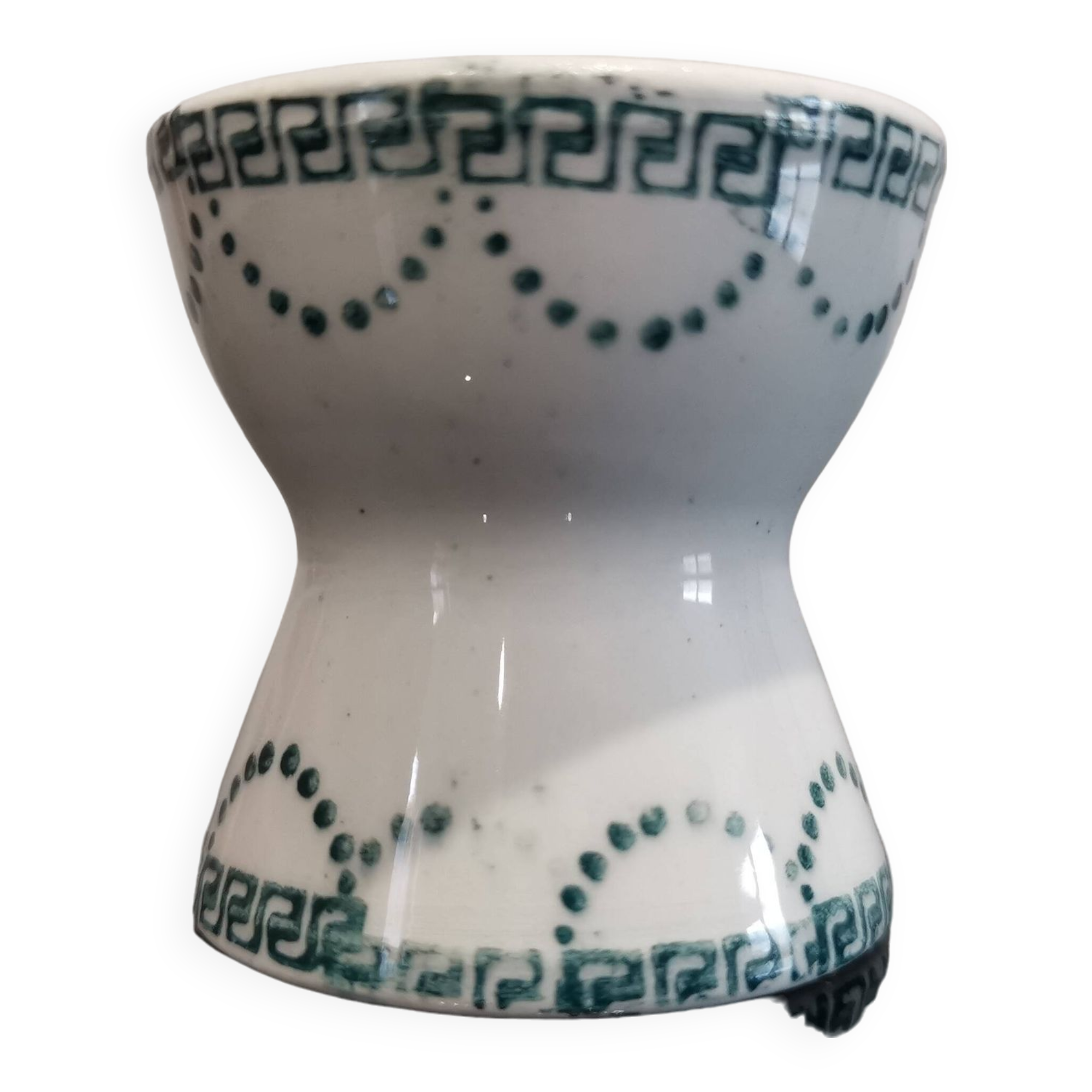 Old porcelain diabolo egg cup decorated with green frieze and garlands