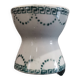 Old porcelain diabolo egg cup decorated with green frieze and garlands