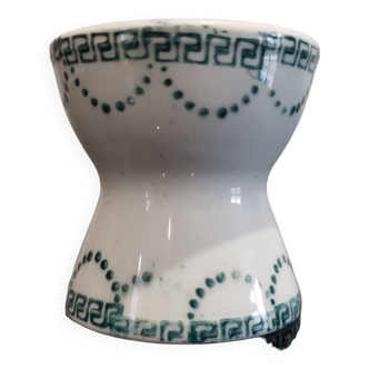 Old porcelain diabolo egg cup decorated with green frieze and garlands
