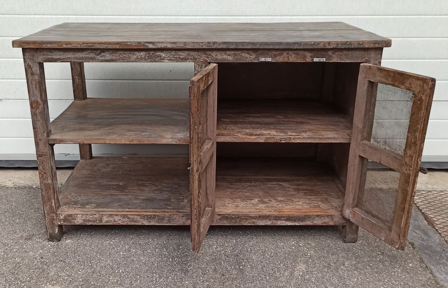 Antique wooden and metal accent furniture with mesh doors