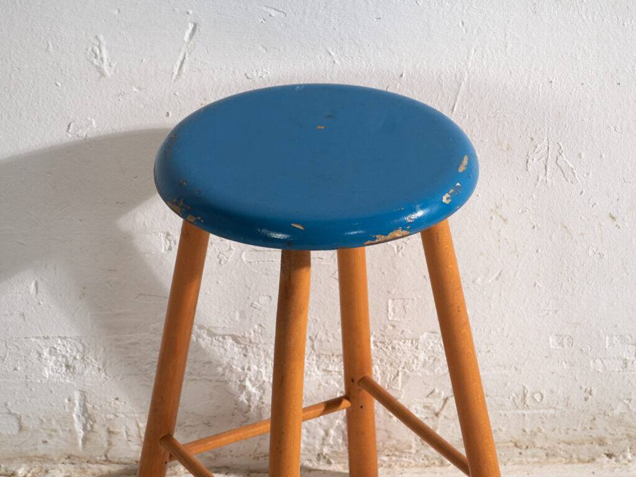 Antique wooden stool with a round seat – Central Europe, around 1950