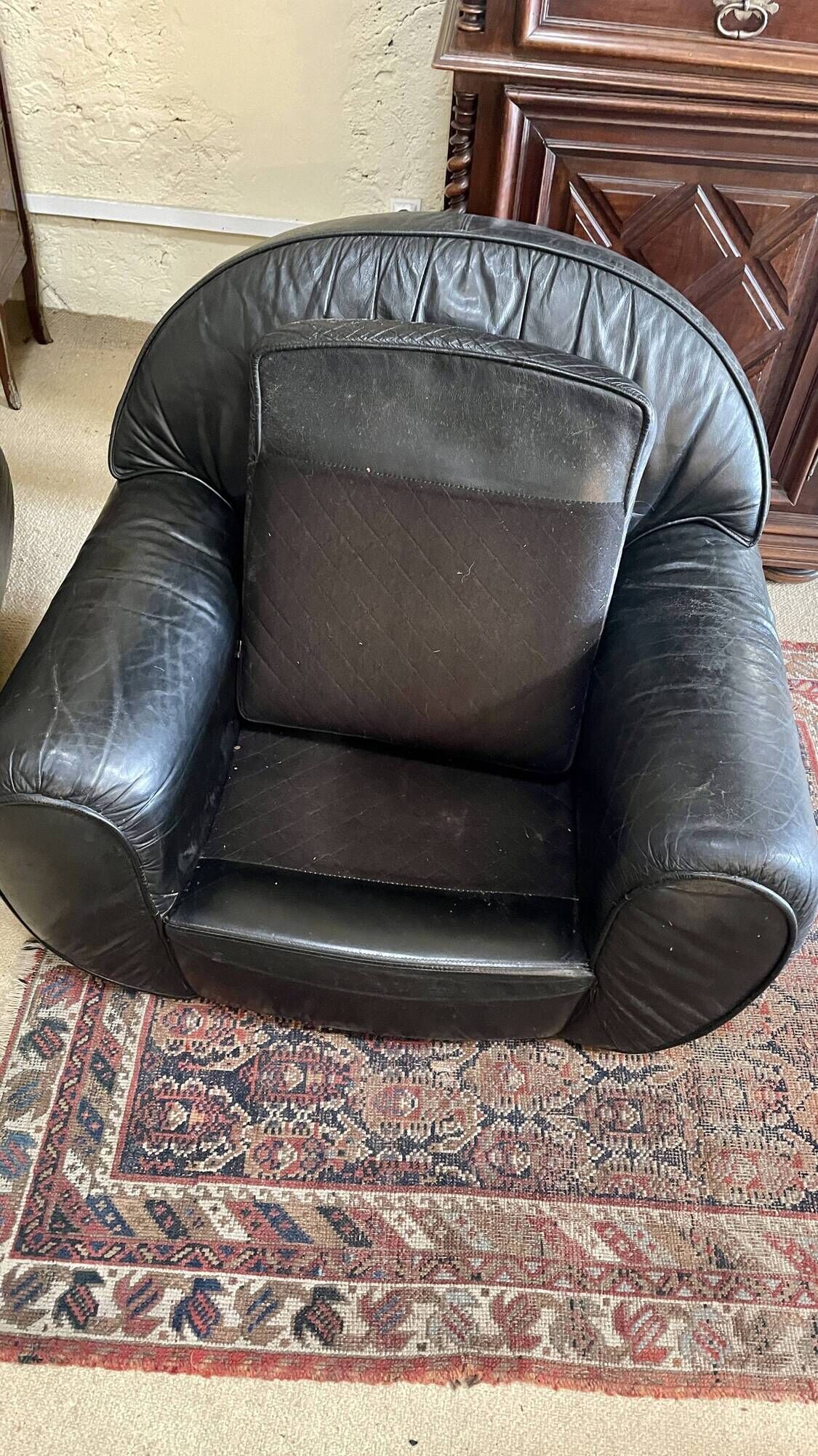 Pair of black leather club armchairs, twentieth century
