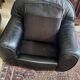 Pair of black leather club armchairs, twentieth century
