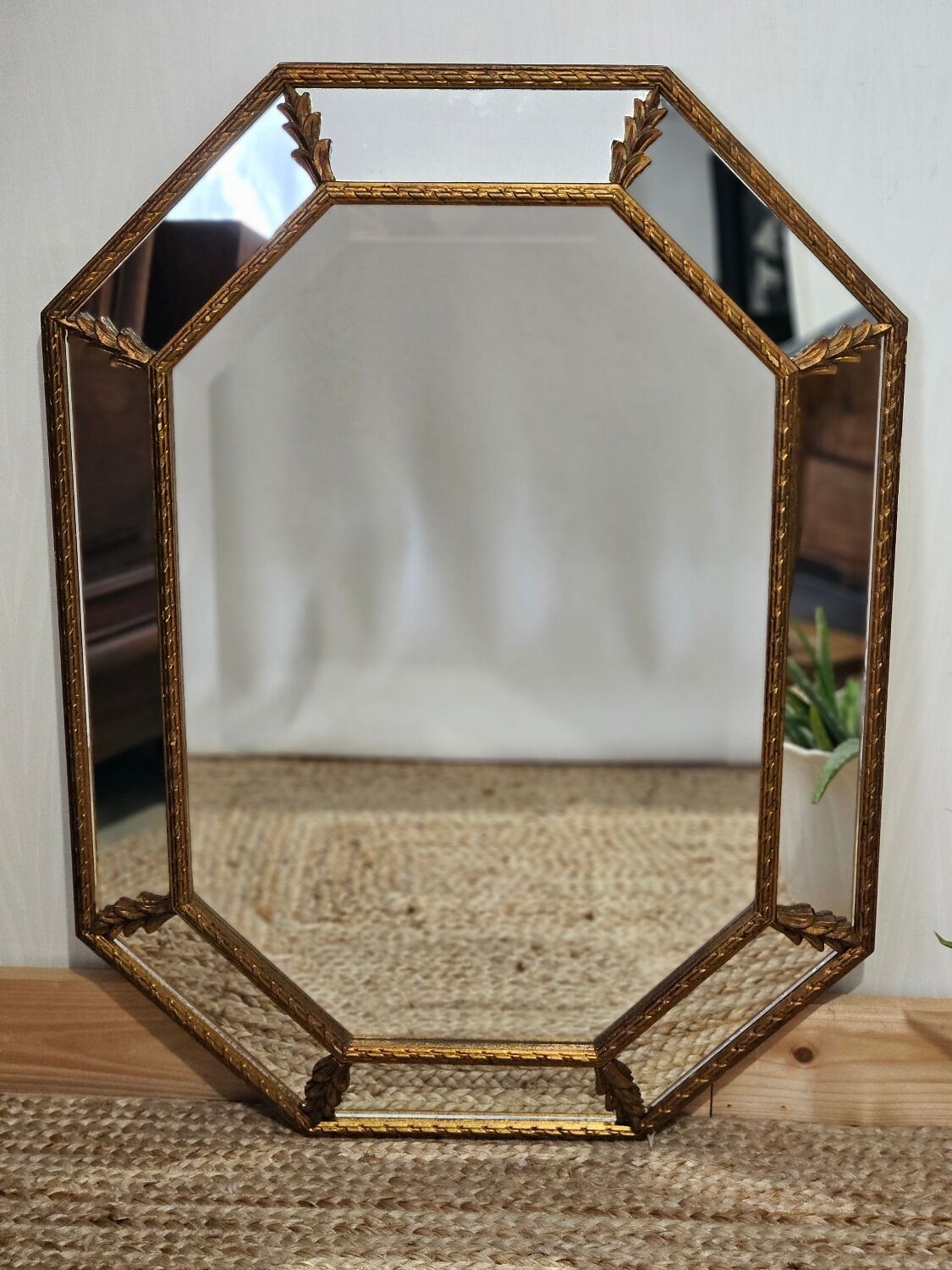 Bevelled mirror with neoclassical parcloses from the 20th century.