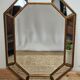 Bevelled mirror with neoclassical parcloses from the 20th century.
