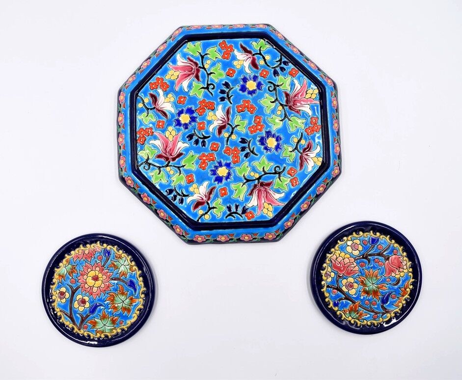 A flat bottom and two enamel bottle bottoms of Longwy