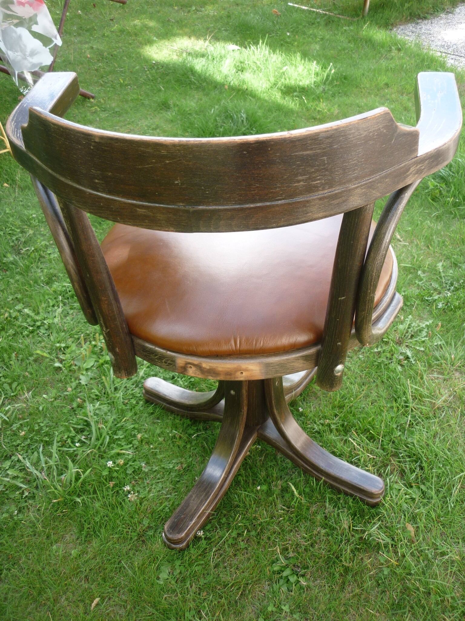 Swivel leather armchair