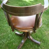 Swivel leather armchair