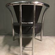 A pair of petite low armchairs by ronald cecil sportes for lumen center, 1987