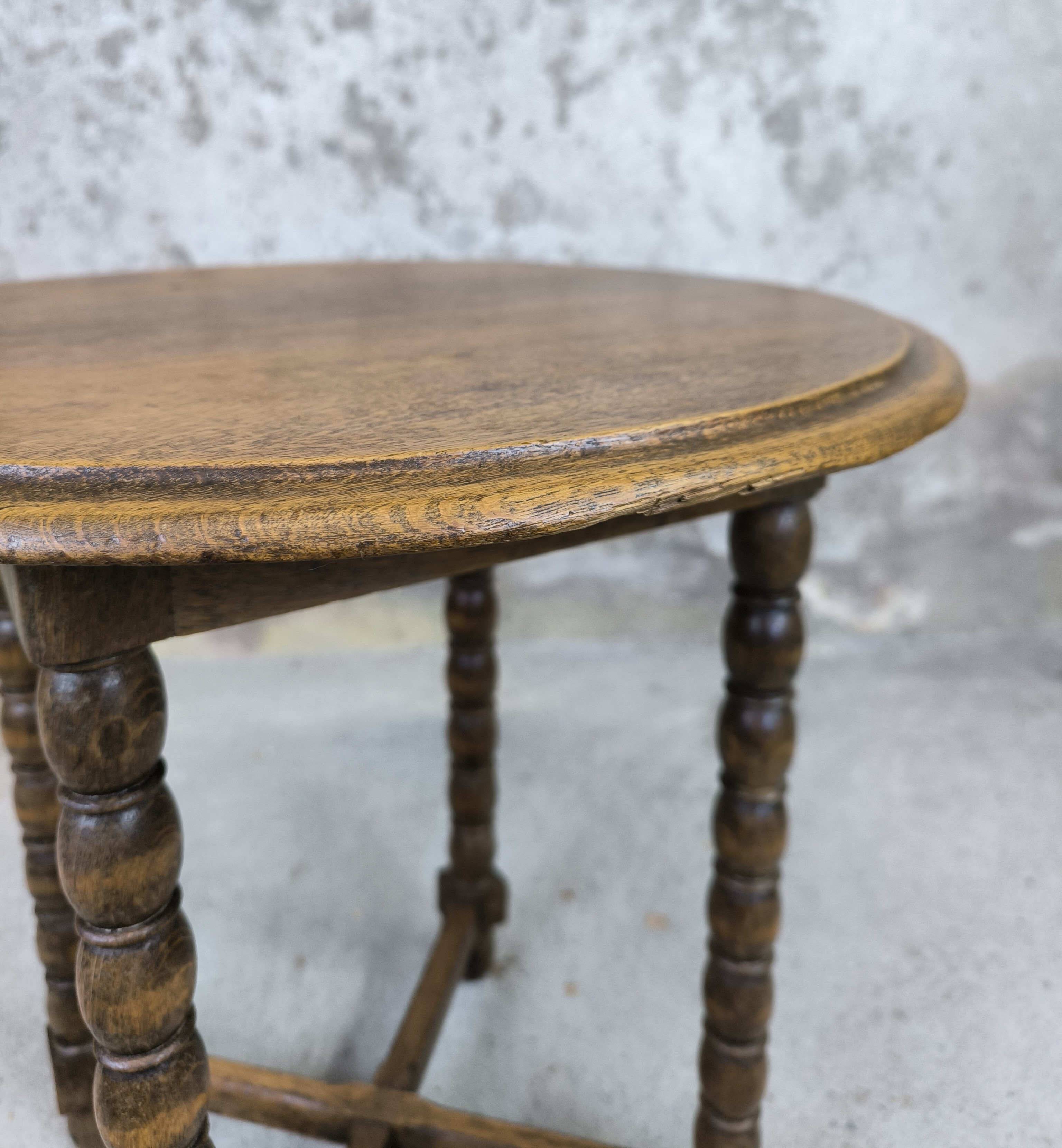 Vintage gueridon with beaded wooden legs.