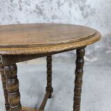 Vintage gueridon with beaded wooden legs.