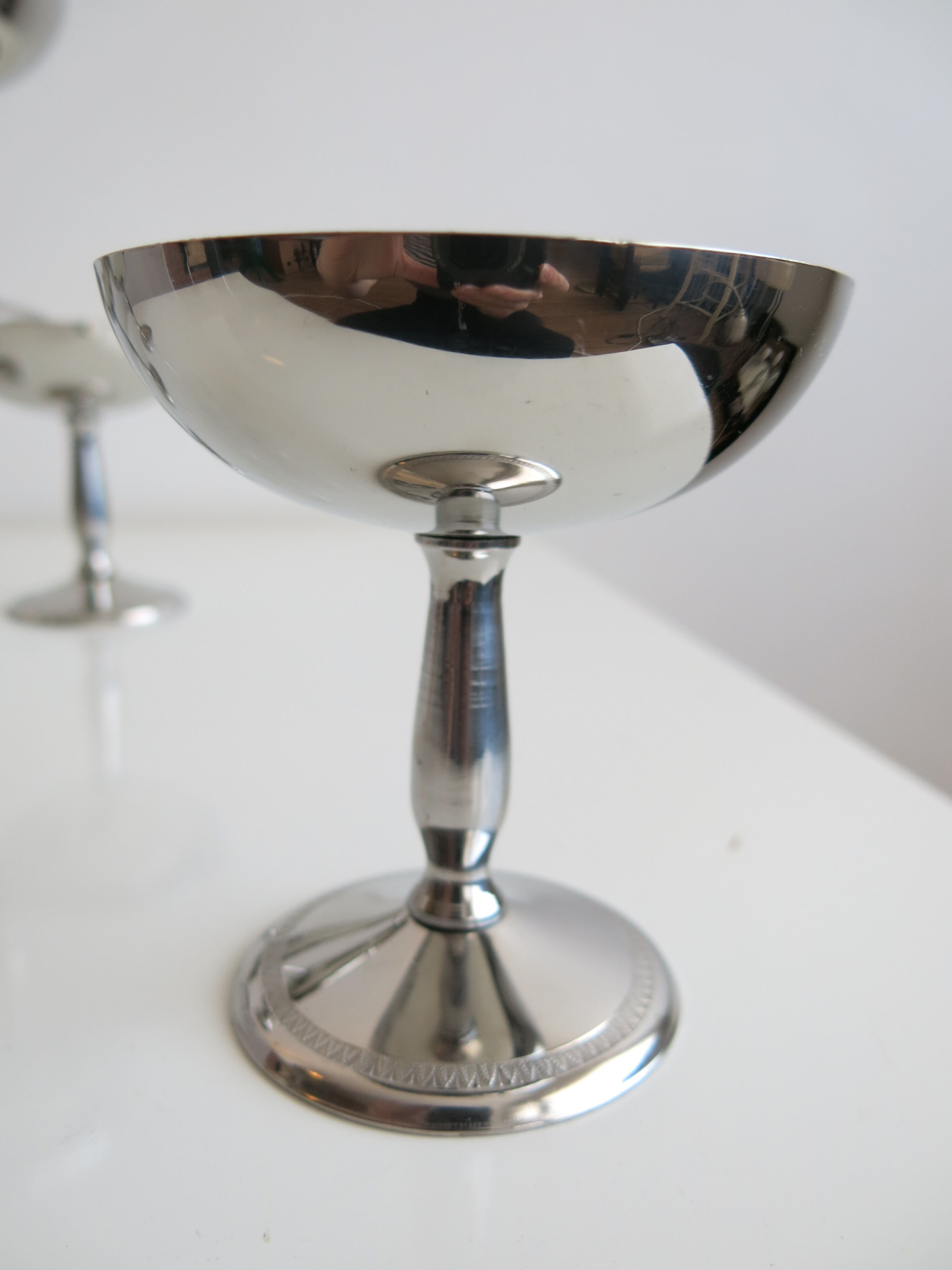 Set of six stainless steel standing cups