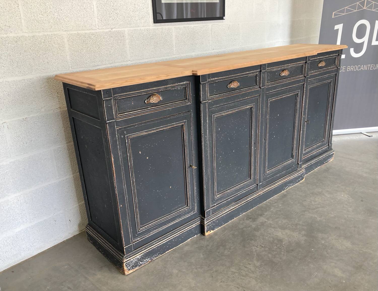 Old sideboard with four doors and four drawers