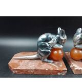 Antique Art Deco bookends in silver-plated metal, bakelite, and marble, signed H. M.