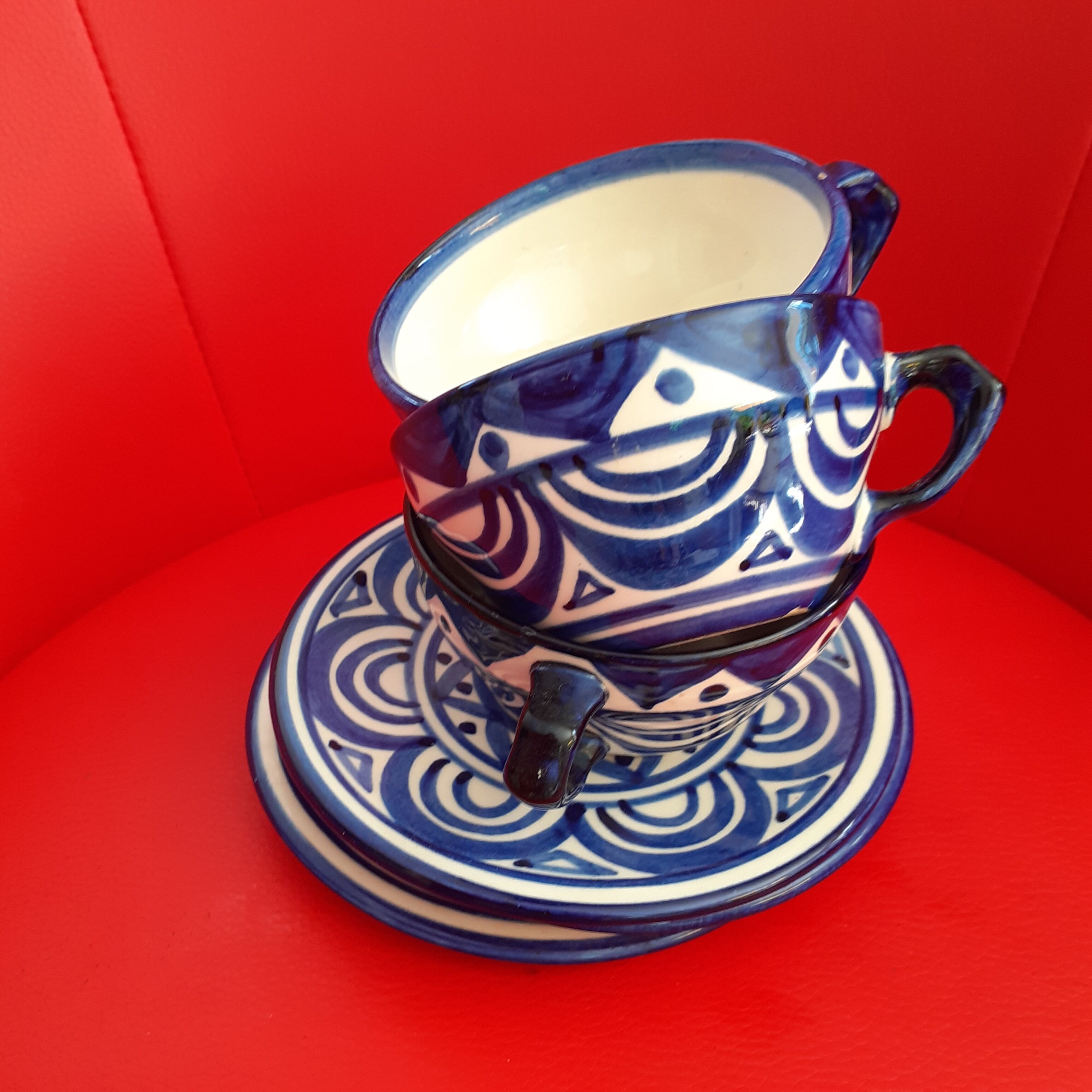 Trio of cups and saucers painted by hand. Blue faience. St John of Brittany.