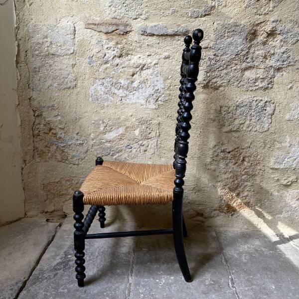 Low chair in turned wood
