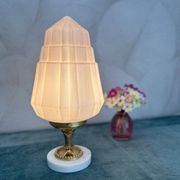 Art Deco lamp with pastel pink opaline globe.