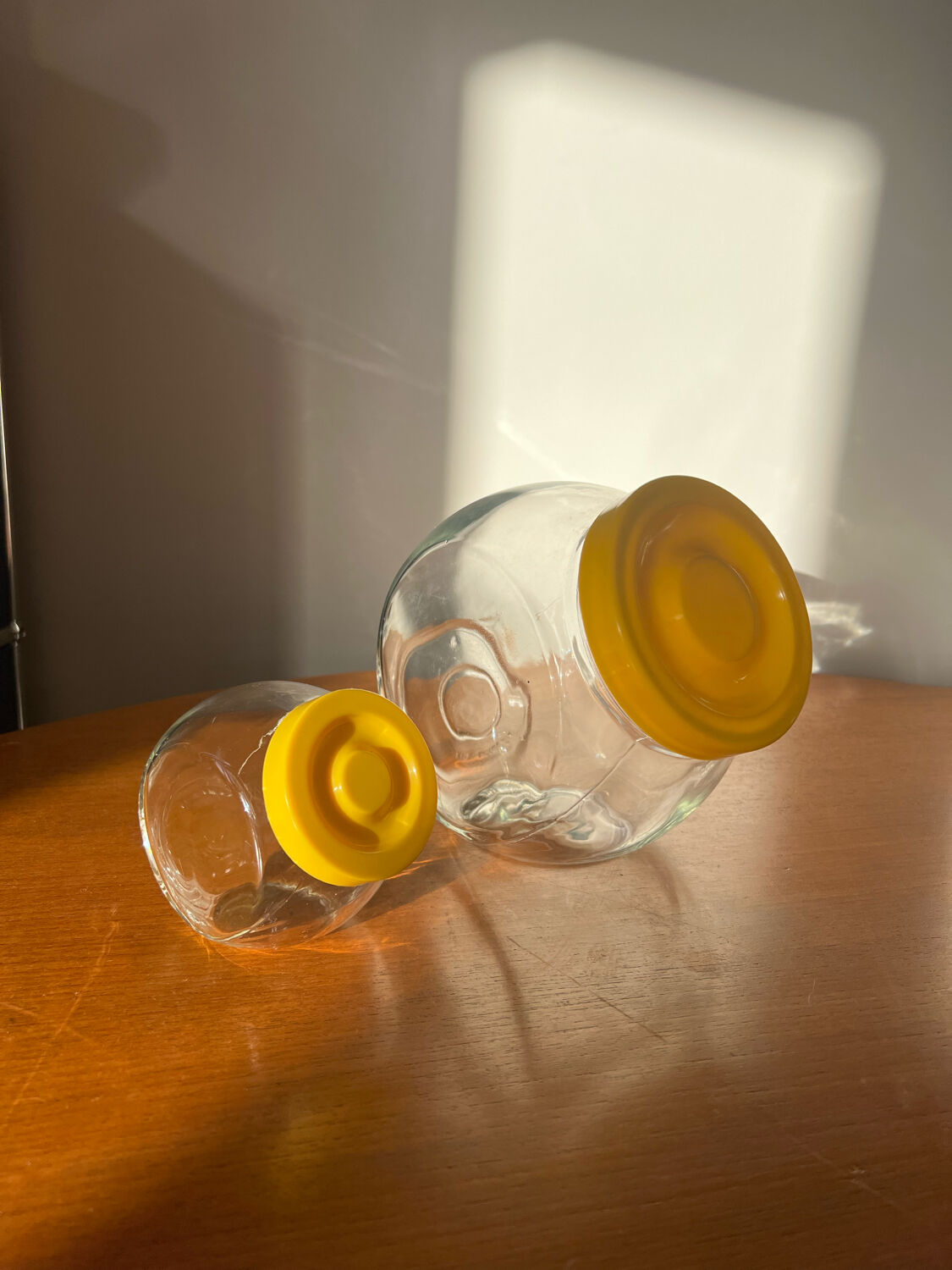 Pair of yellow vintage candy jars