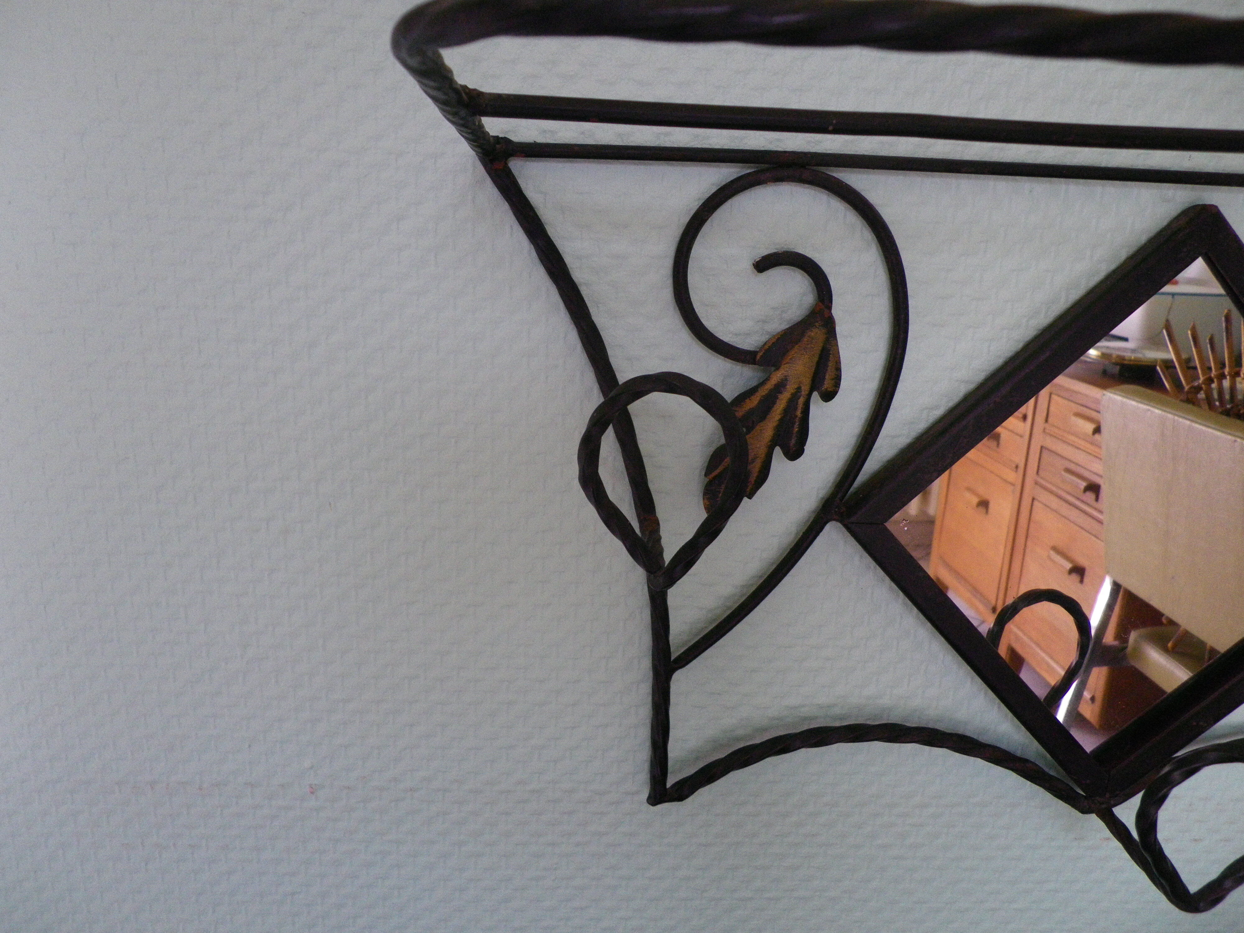 Wrought iron wall holder with top support and built-in mirror